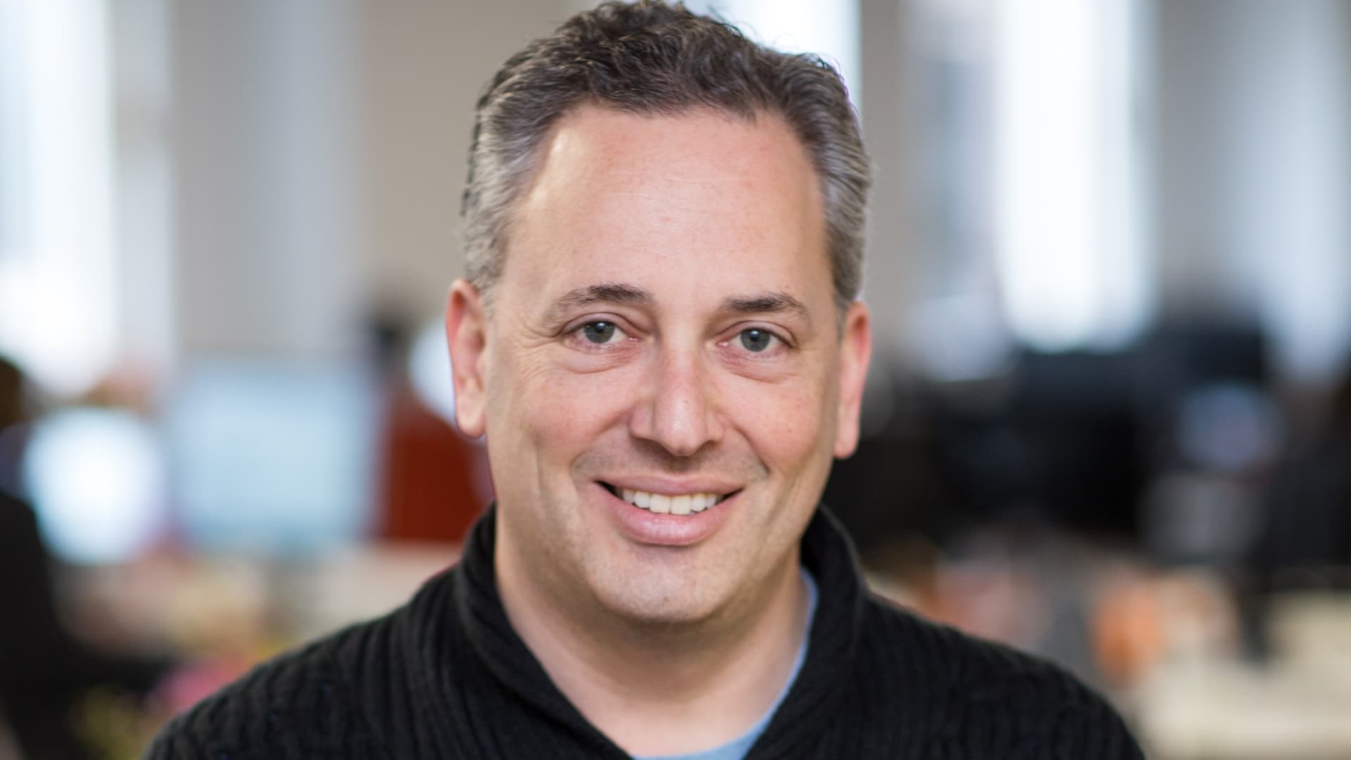 David Sacks smiling in a professional headshot photo taken in an office setting