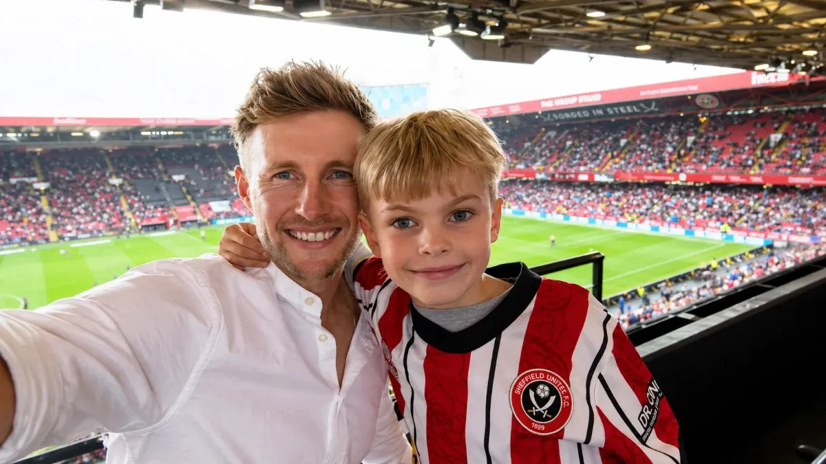 A heartwarming photo of Joe Root with his son, Alfie, wearing Sheffield United jerseys, reflecting the grounded personal life that enhances the Joe Root net worth through relatable brand endorsements.
