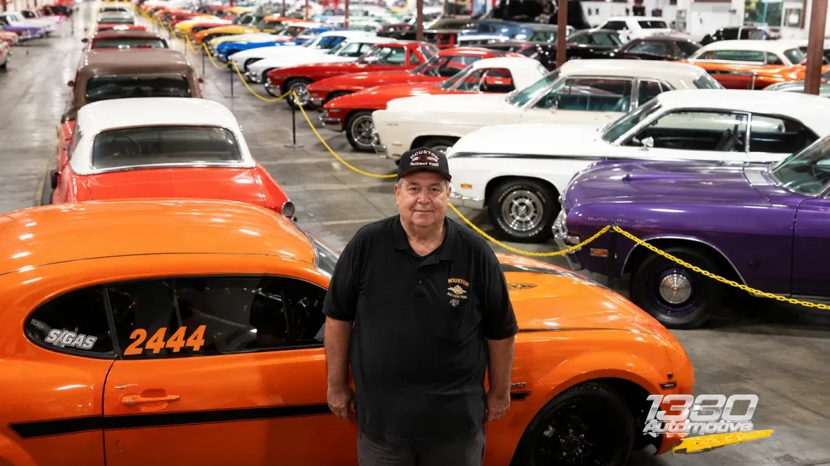 Don Baskin standing in a classic car showroom surrounded by vintage vehicles – Don Baskin Net Worth