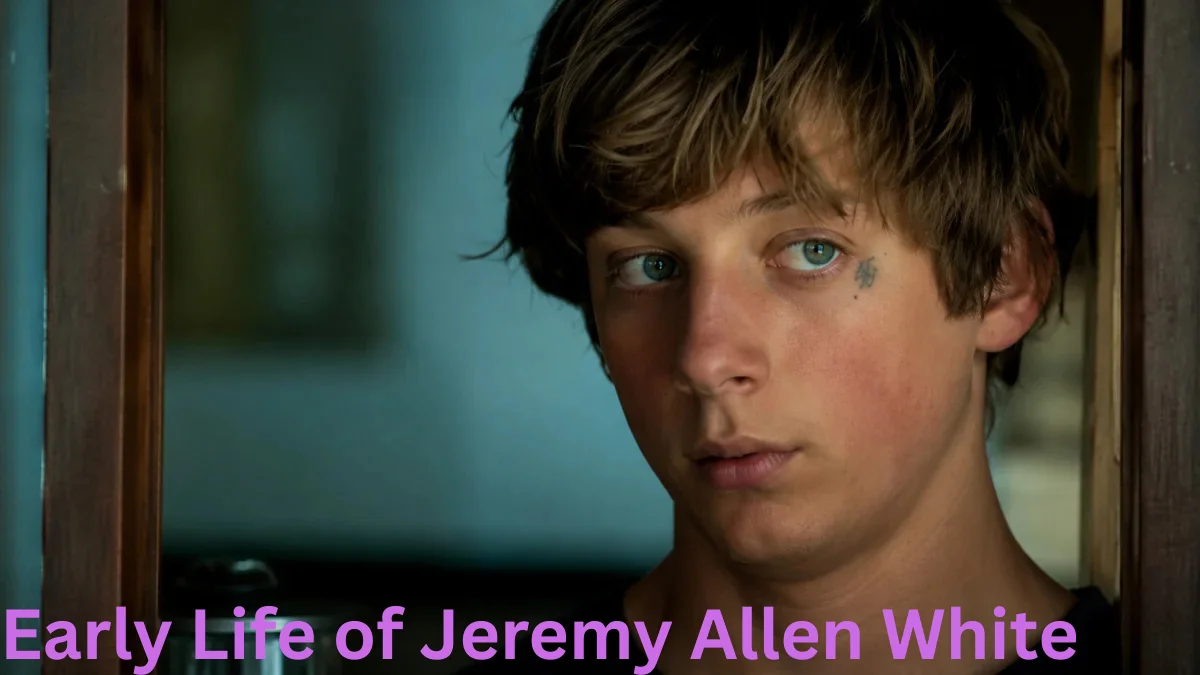 Jeremy Allen White Net Worth close-up portrait image showing Jeremy Allen White with a thoughtful expression and cinematic indoor lighting.