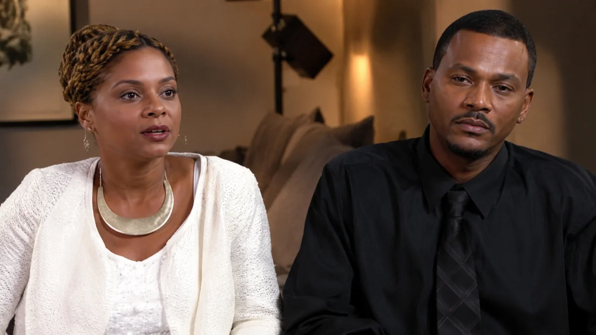 Lark Voorhies inspired indoor interview-style portrait of a stylish couple sitting together in a modern living room setting