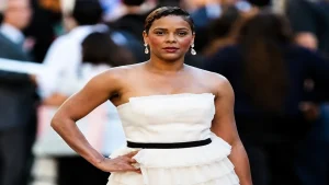 Lark Voorhies wearing a white strapless dress during a red carpet celebrity event
