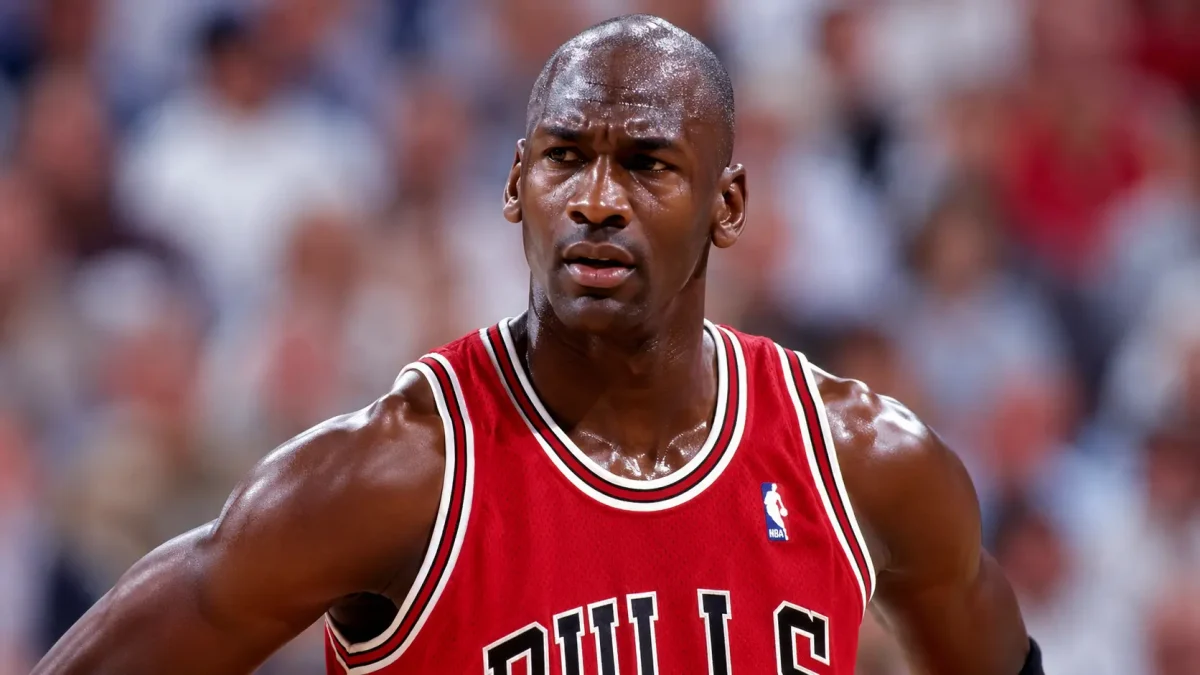 Michael Jordan in Chicago Bulls jersey during NBA game action – Michael Jordan Net Worth and basketball legacy image