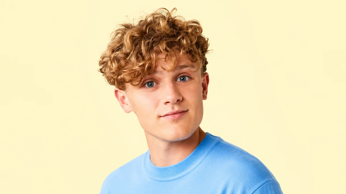 Close-up portrait of Ryan Trahan in a blue shirt for Ryan Trahan Net Worth and YouTube creator profile content