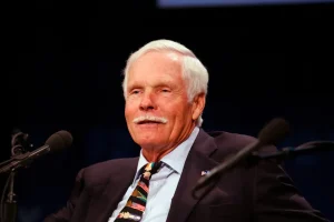 A portrait of media pioneer Ted Turner, the visionary founder of CNN and the UN Foundation, who passed away on May 6, 2026, leaving a historic impact on global journalism.