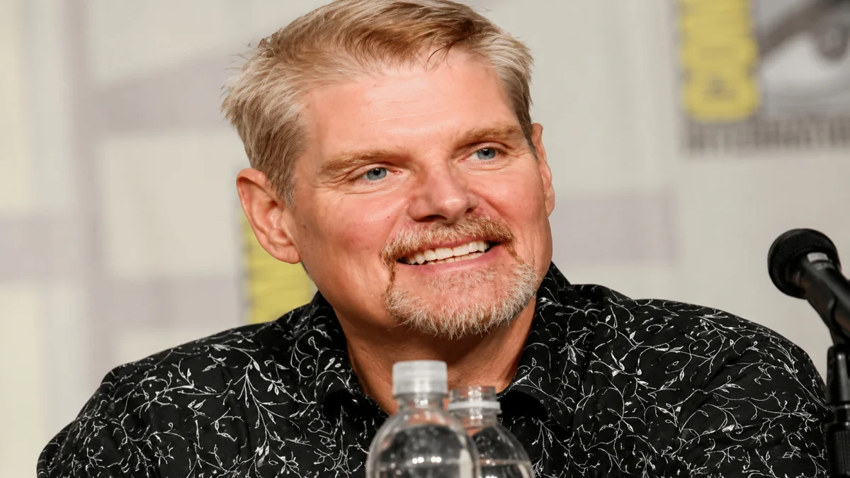 Tom Kane smiling during a public event with a professional portrait-style appearance for Tom Kane profile and entertainment content.
