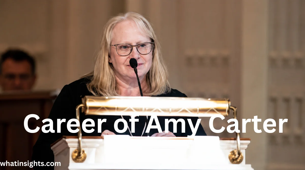 Amy Carter speaking at a podium during a public event, showcasing her professional career and achievements related to Amy Carter Net Worth.