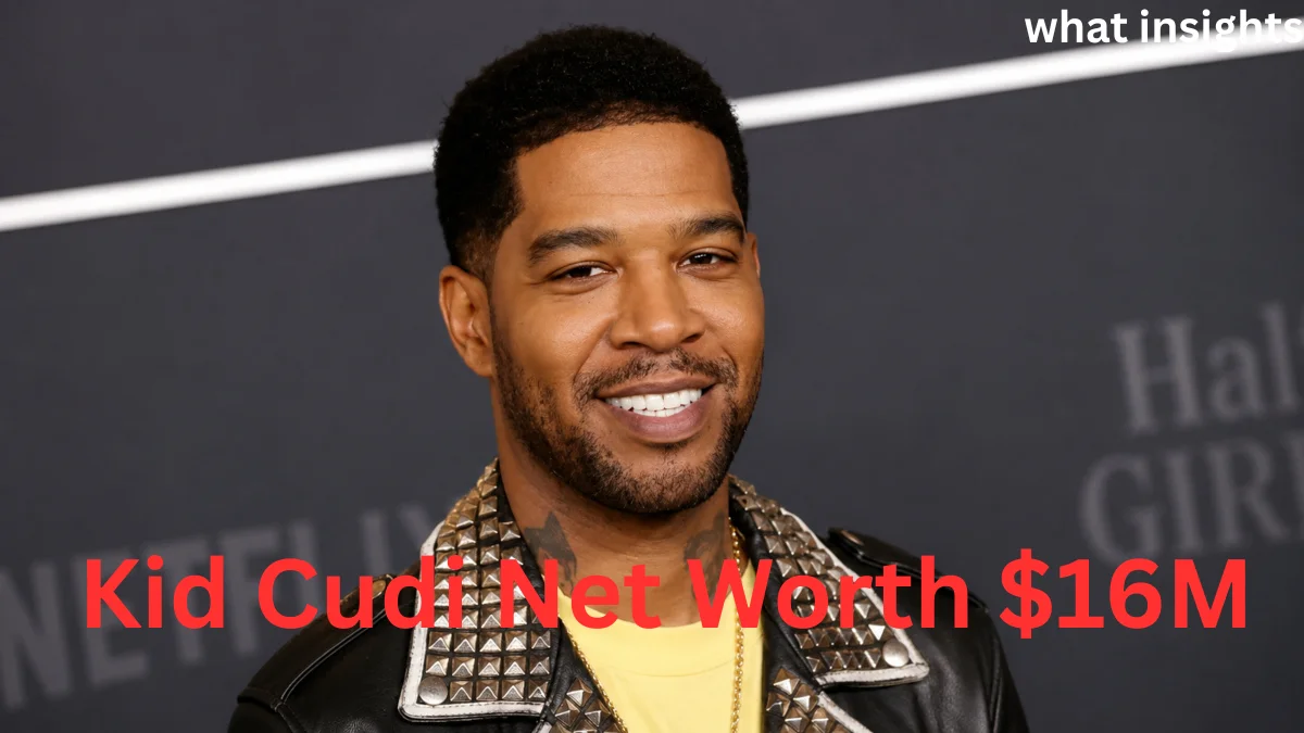 Kid Cudi smiling at a red carpet event, featured in an article about Kid Cudi Net Worth and his successful entertainment career.