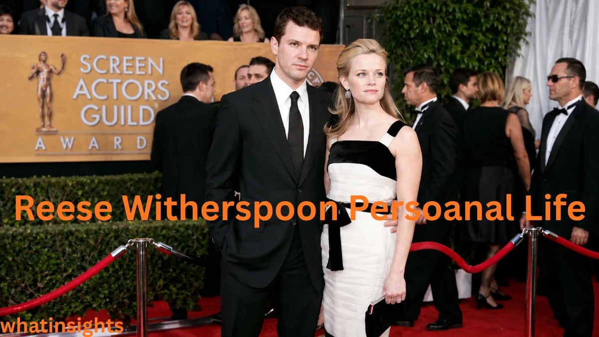 Reese Witherspoon standing on the red carpet at the SAG Awards with her partner, surrounded by media and guests, dressed in an elegant gown at a formal Hollywood event — Reese Witherspoon Net Worth